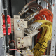 An electrical panel with a complex network of industrial wiring and crimped connectors, highlighting the importance of reliable terminations.