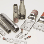 Close-up of a compression lug and a crimp die, highlighting the color coding and die index numbers required for a UL 486 compliant electrical termination.